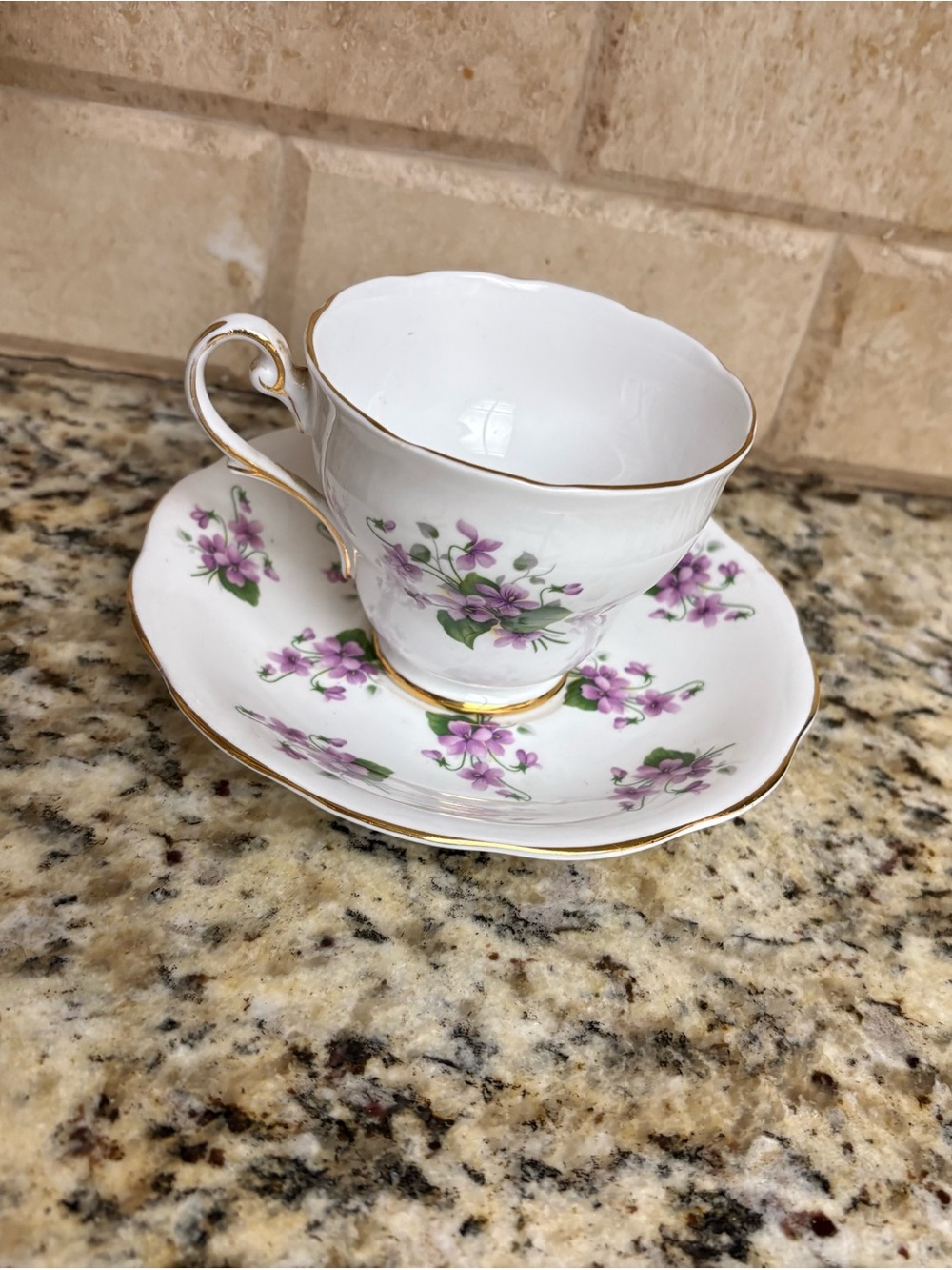 White Teacup & Saucer with Purple Floral Pattern and Gold Trim